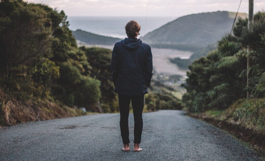 A highly sensitive man standing on a path.
