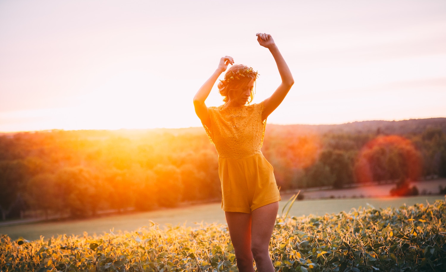 A highly sensitive person dances in a field.