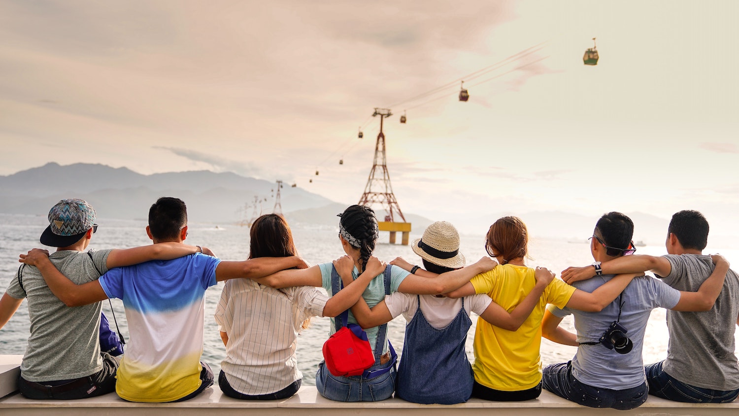 A group of friends sitting close together and sharing a meaningful connection