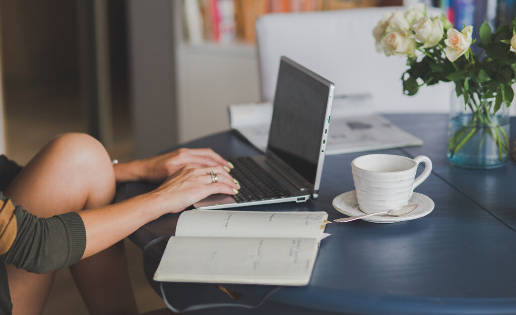 A highly sensitive person types on their laptop