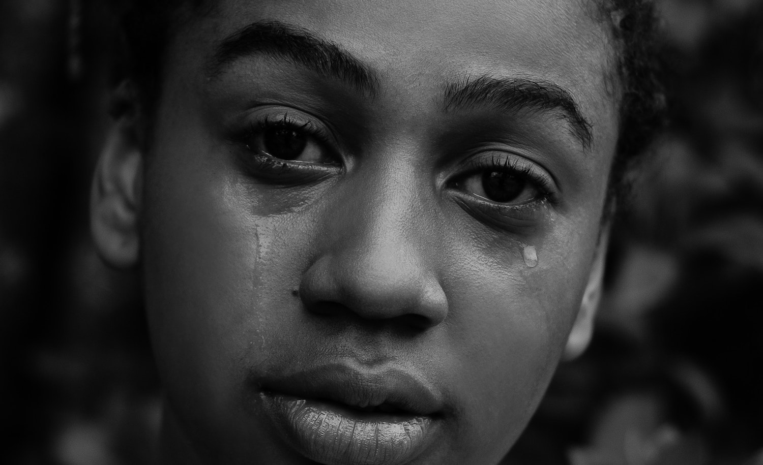 Close up of a woman crying from grief