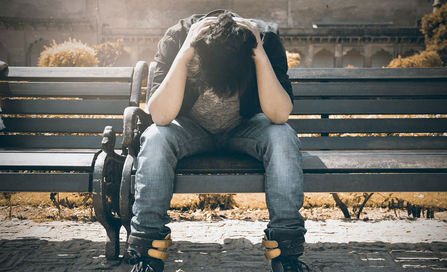 An overwhelmed woman sitting at a desk