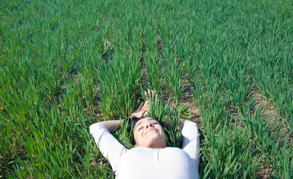 A highly sensitive person lies in the grass
