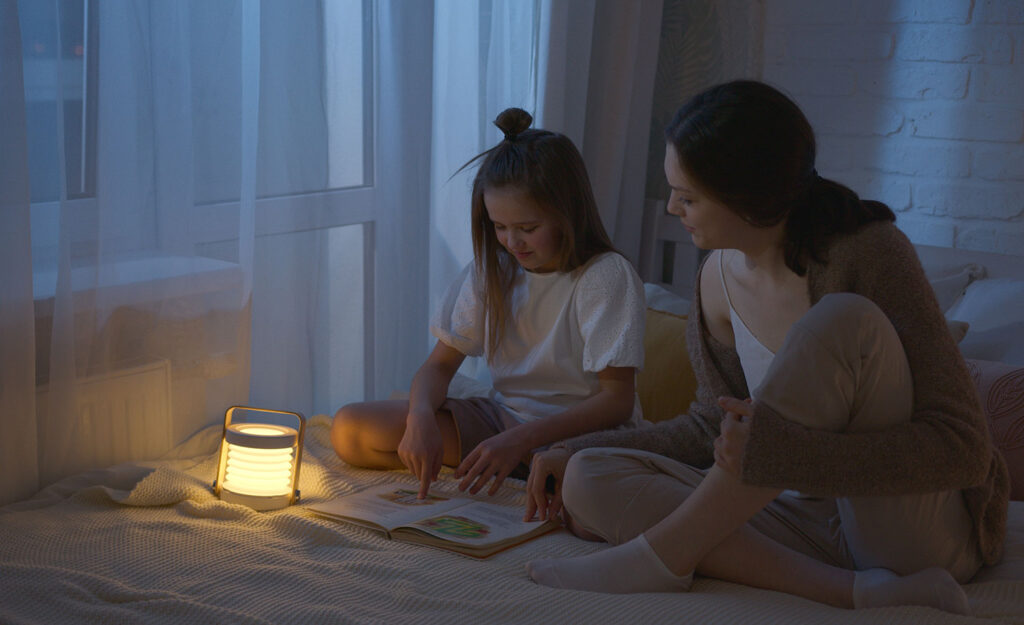 A highly sensitive child reads a book to her mother