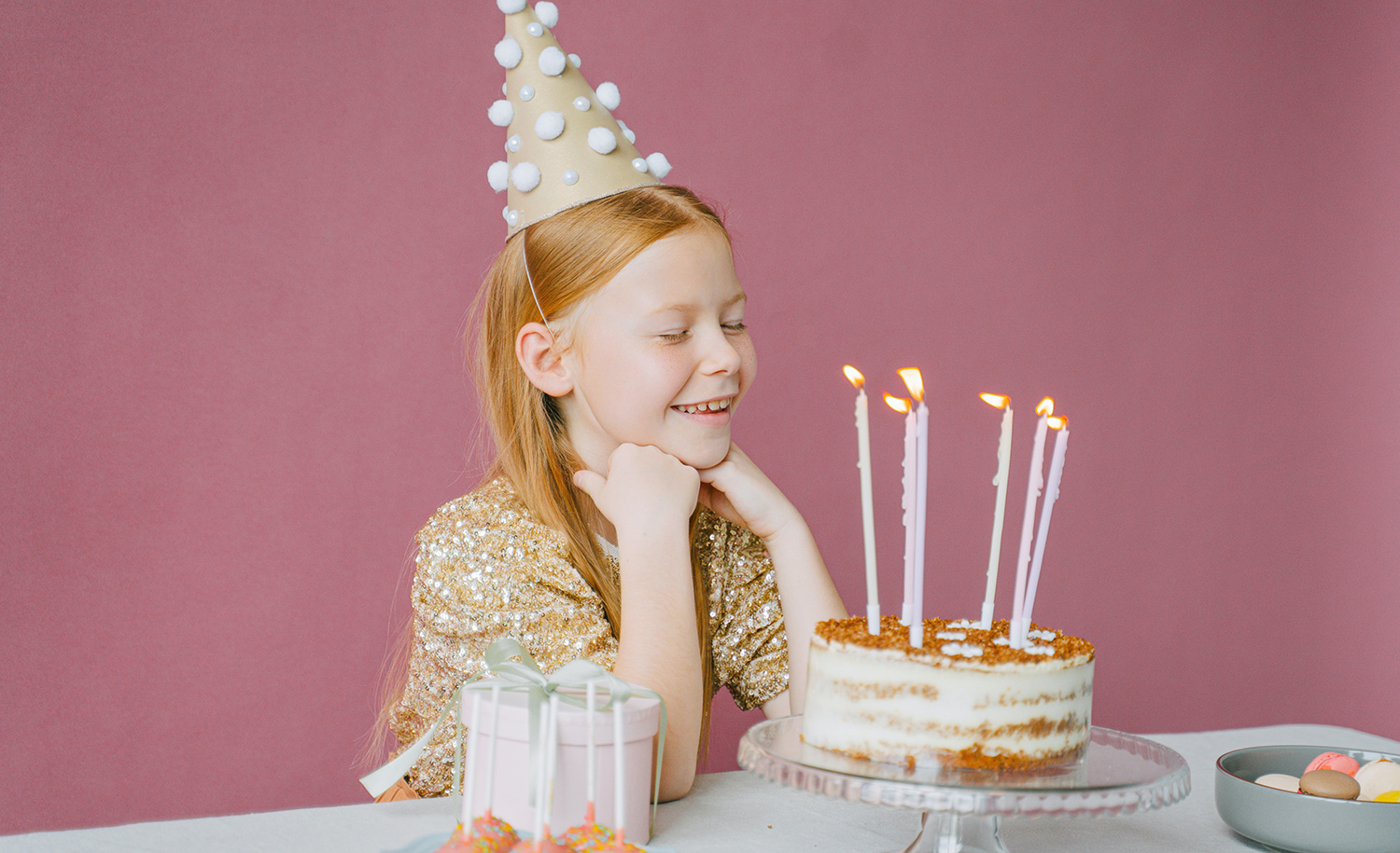A highly sensitive child gets ready to blow out the candles on her birthday cake