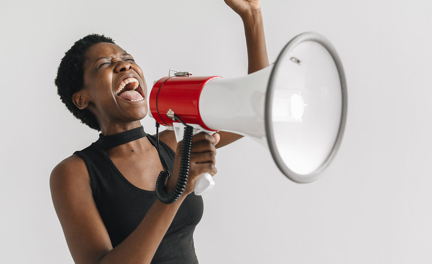 An HSP uses her voice to speak into a megaphone