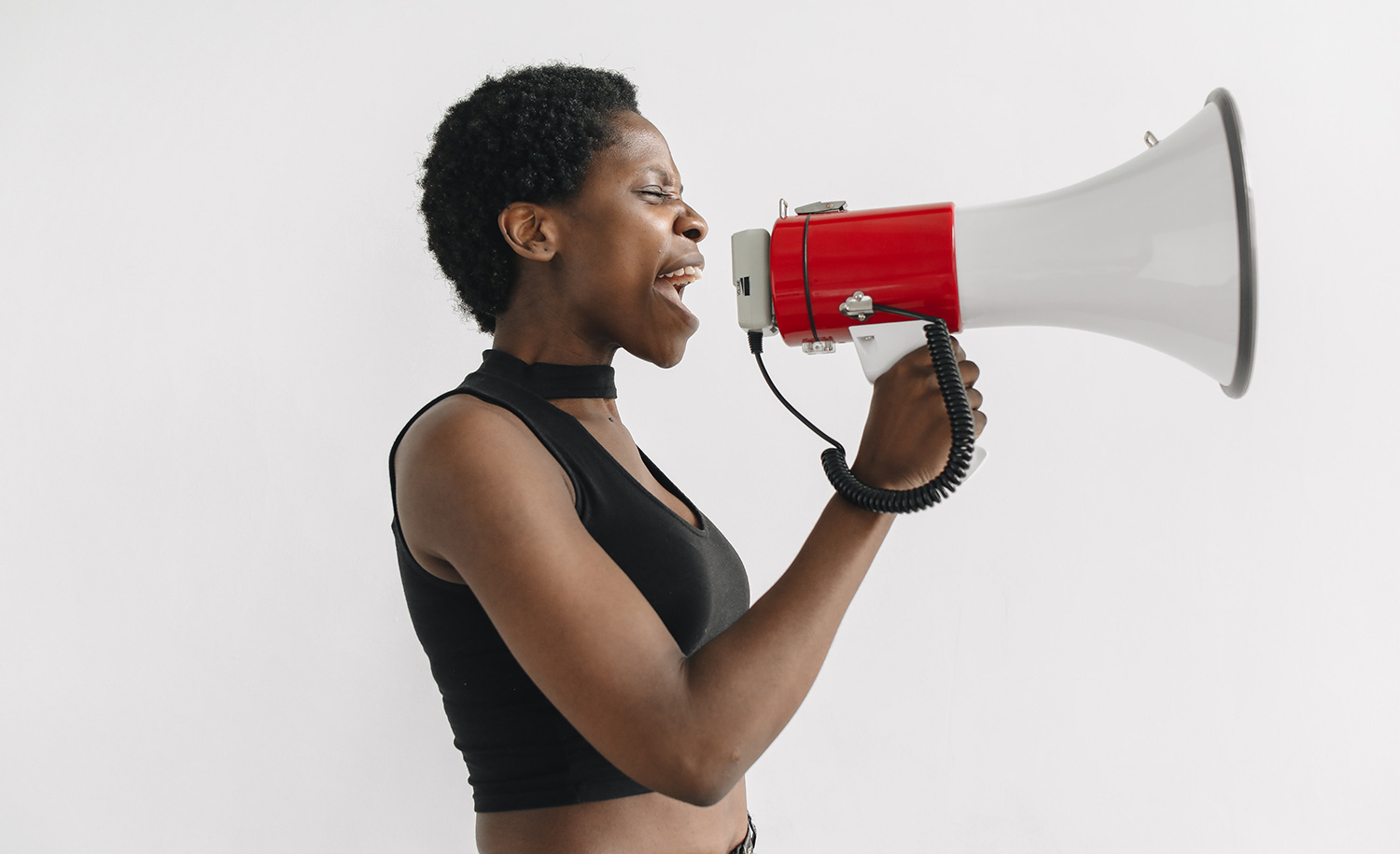 A highly sensitive woman speaks into a megaphone