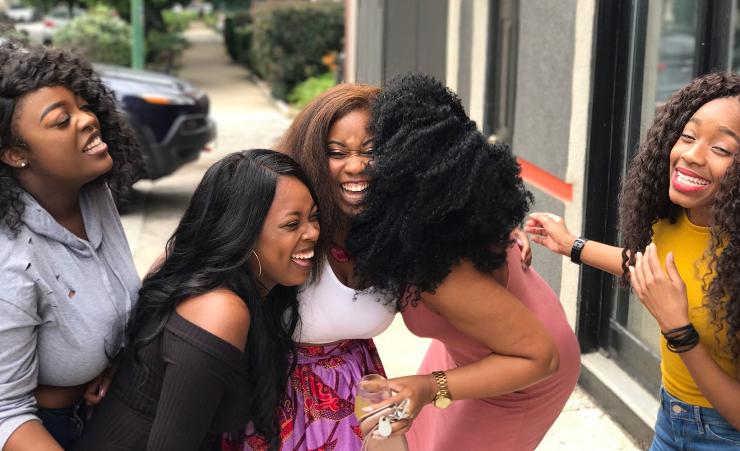 A highly sensitive woman laughs with her friends