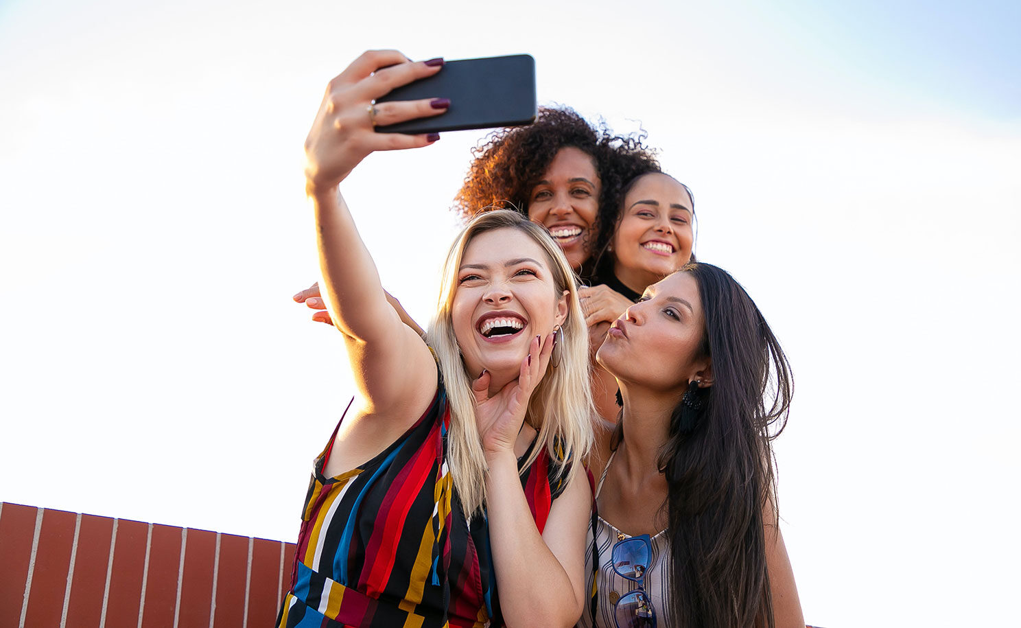 An extroverted HSP takes a selfie with friends