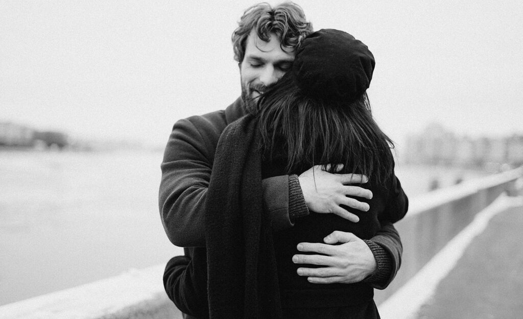 A man and woman hug to show forgiveness