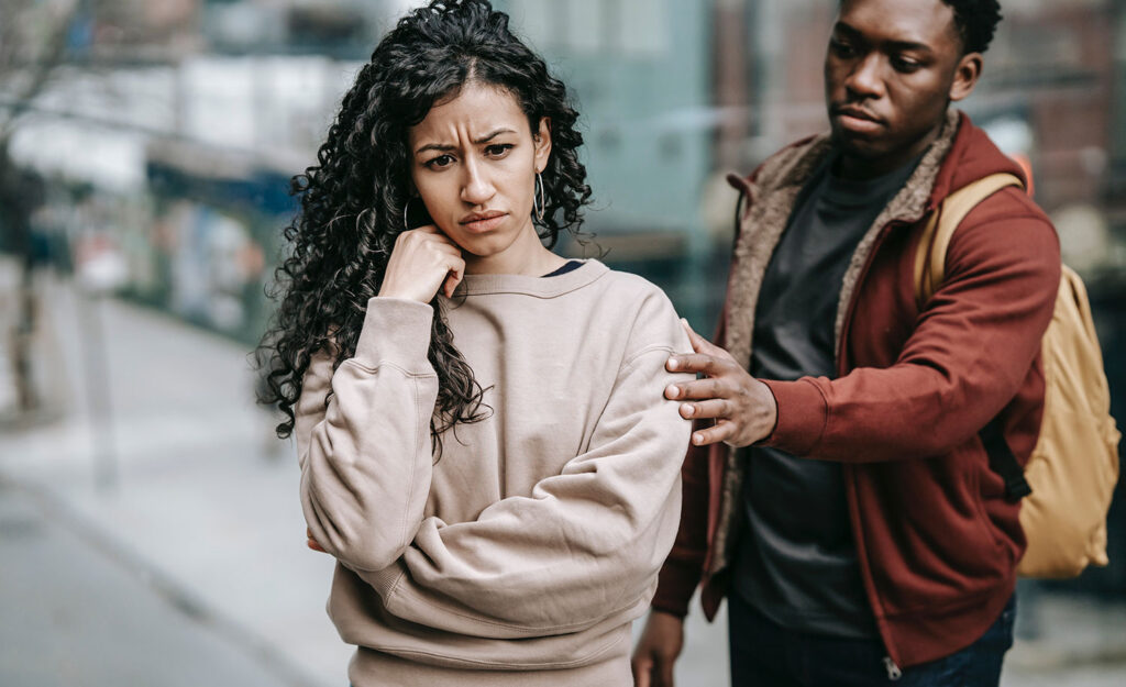 A man tries to grab a highly sensitive woman’s arm