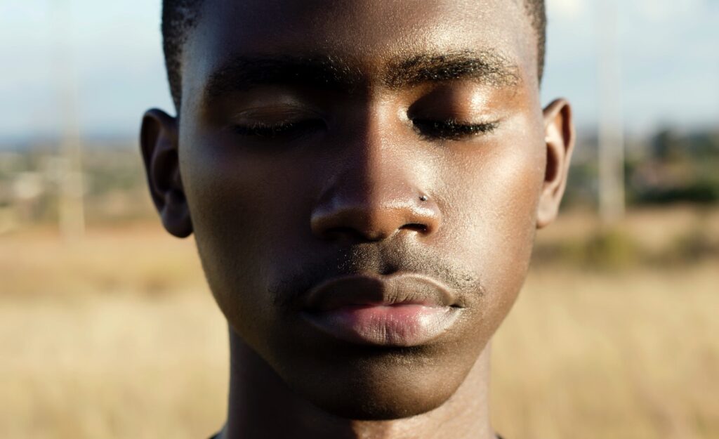 A highly sensitive person with reconsidering his expectations with his eyes closed
