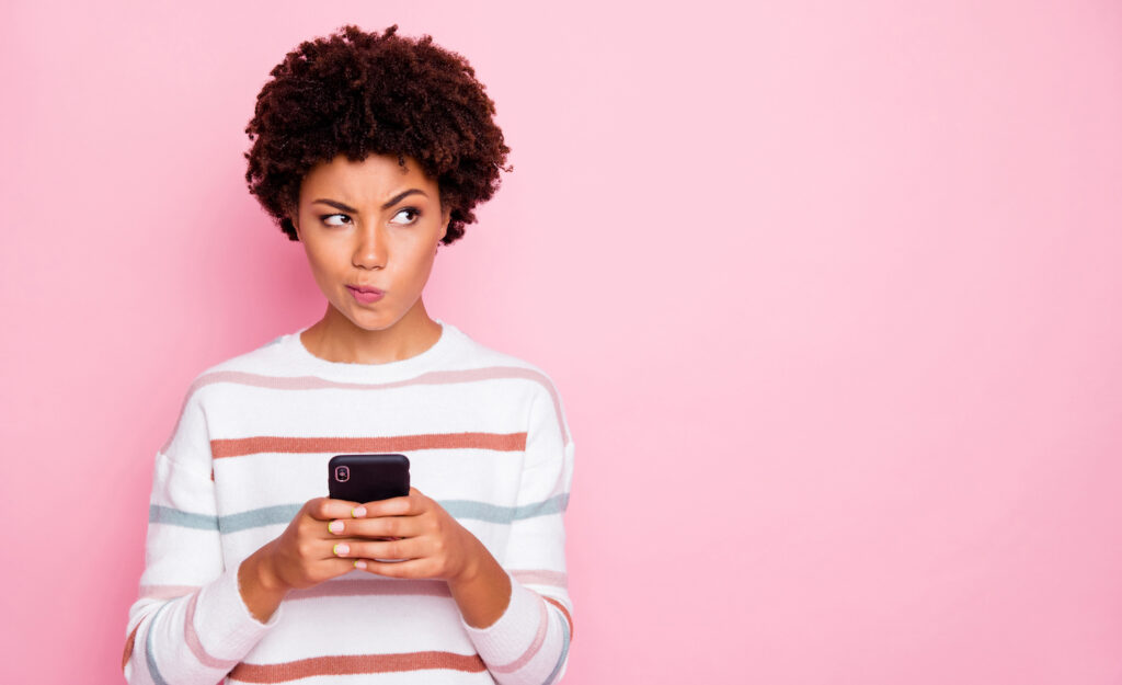 A woman texting her boss about work-life boundaries